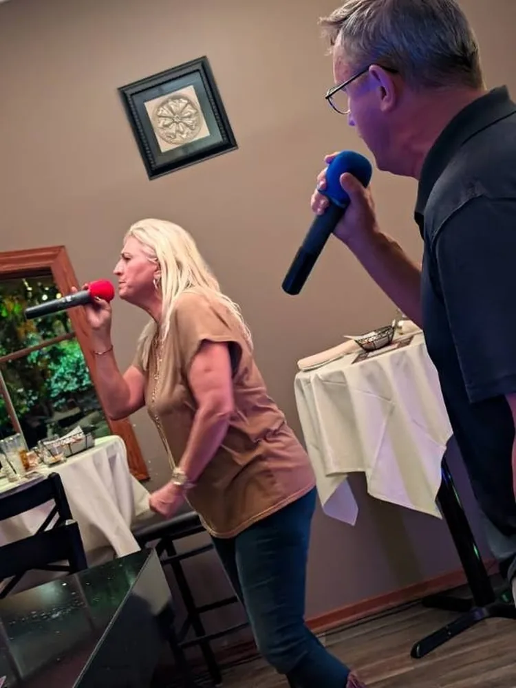Two guests sharing the mic at Jen’s Guesthouse
